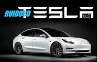a white tesla model s with the words rudoo llc
