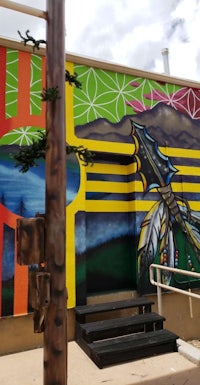 a colorful mural painted on the side of a building
