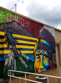 a colorful mural painted on the side of a building